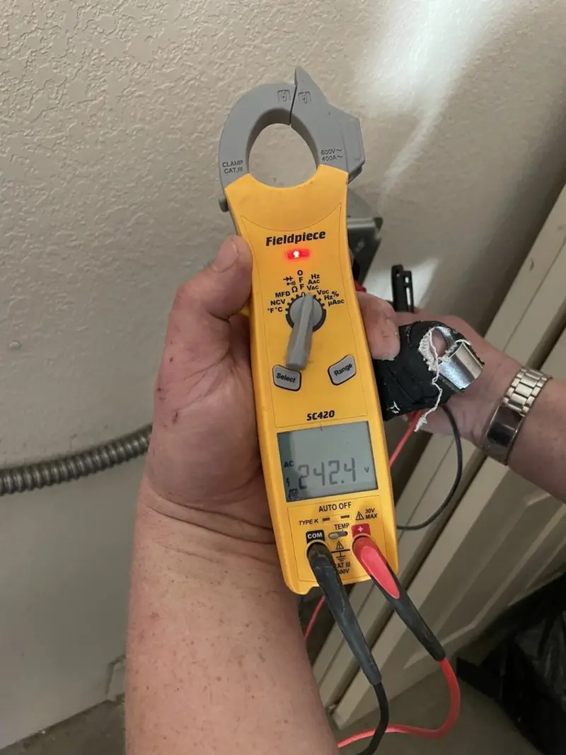 Voltage testing with clamp meter during Generator Installation in Whitfield